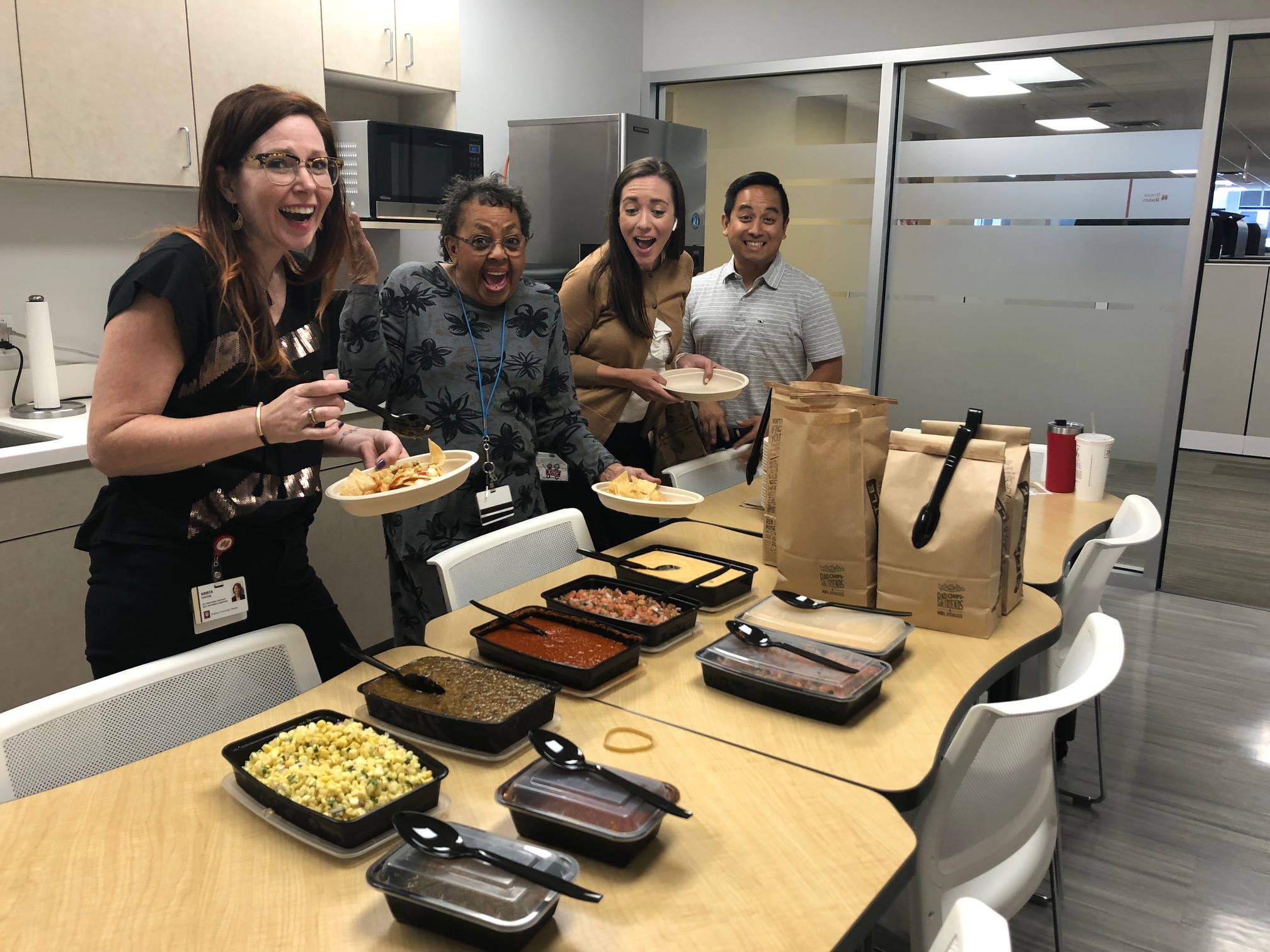 Staff enjoy Chipotle catering in the office