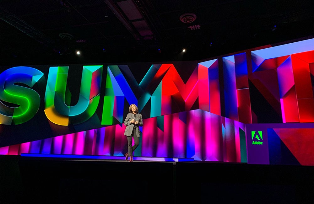 Adobe staff talks on stage at Summit event