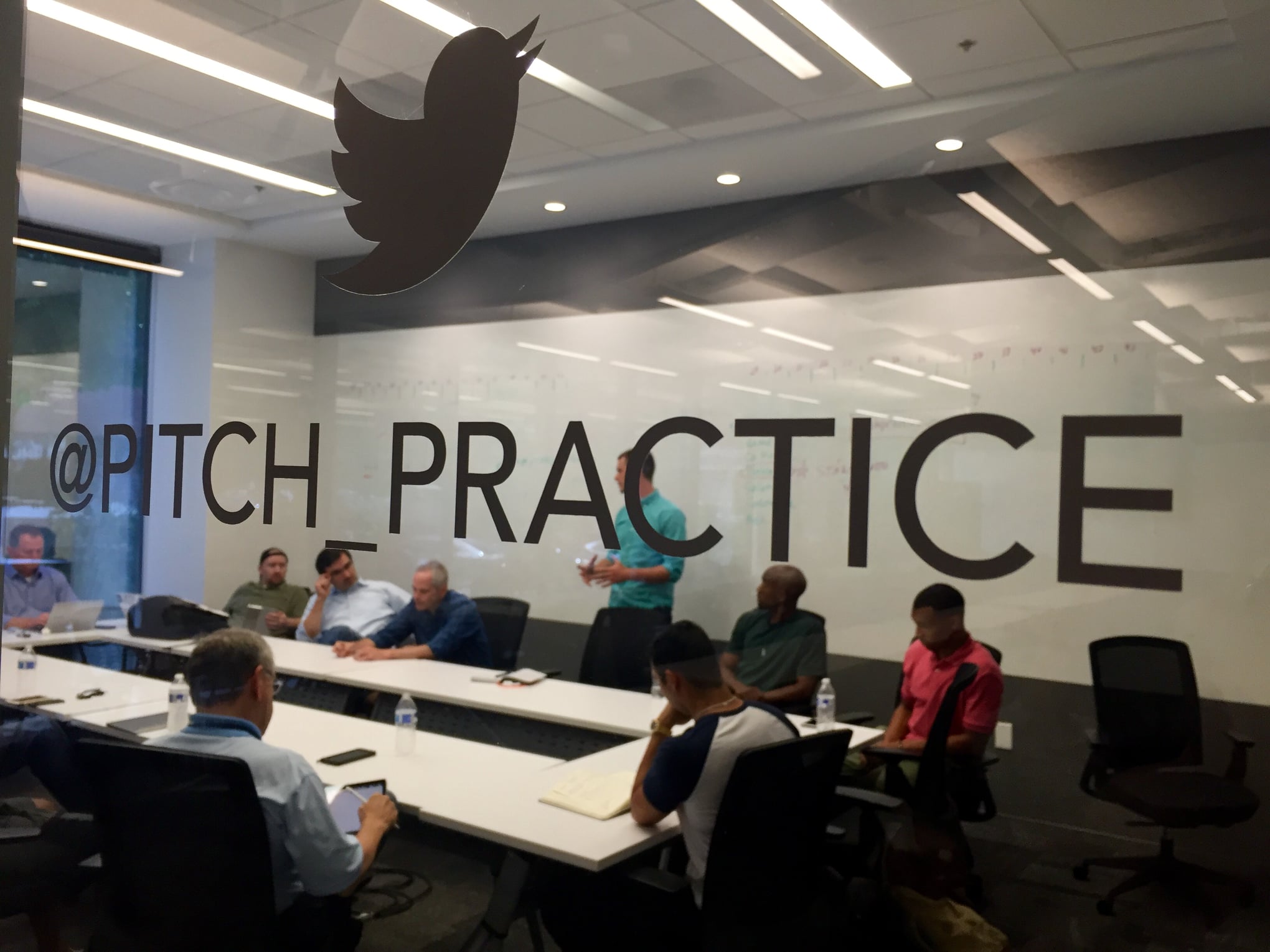 Startup founders practice pitch