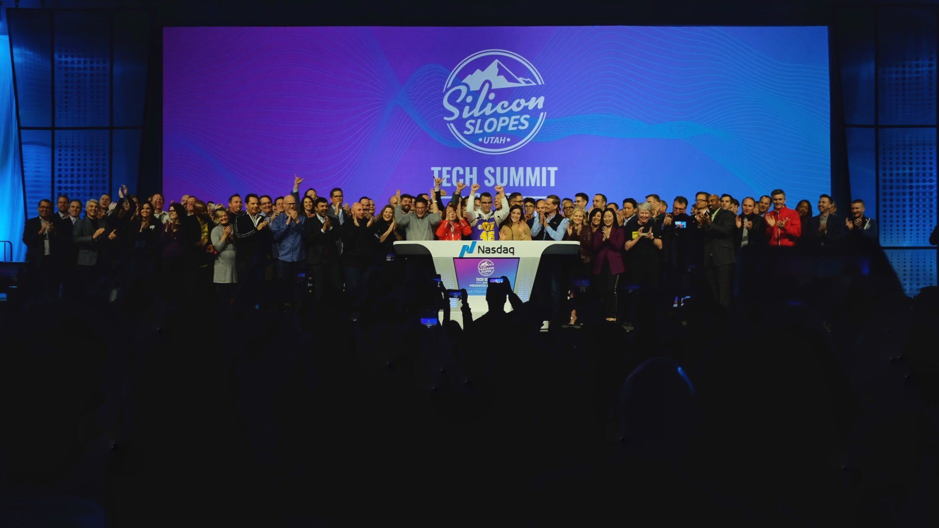 tech companies celebrate on stage at Silicon slopes tech summit