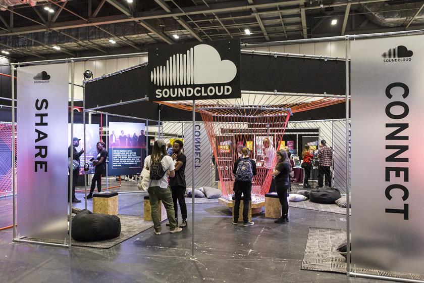 people network at SoundCloud booth in a conference