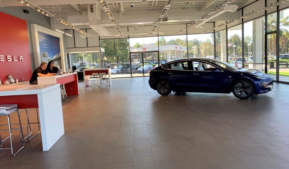 Tesla showroom with consumers
