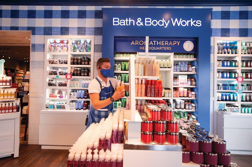 a male staff restock in Bath & Body Works store
