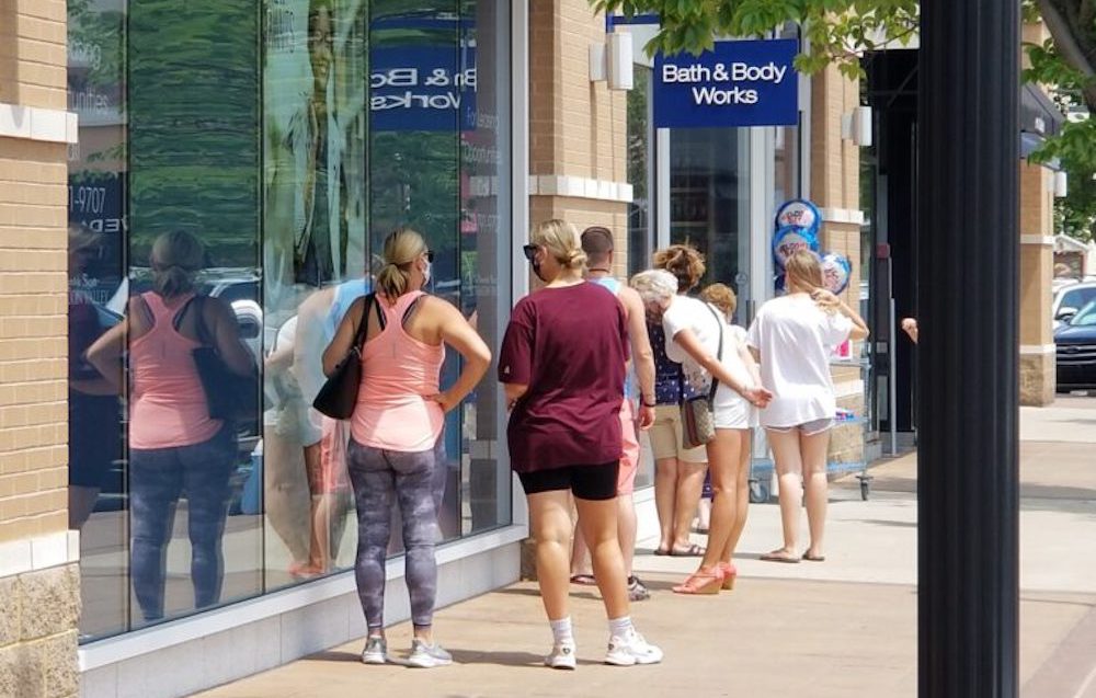 customers are wating in line at Bath & Body Works