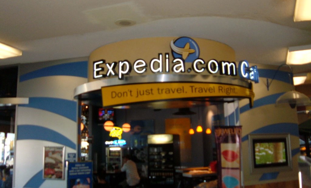 Expedia marketing banner at an airport