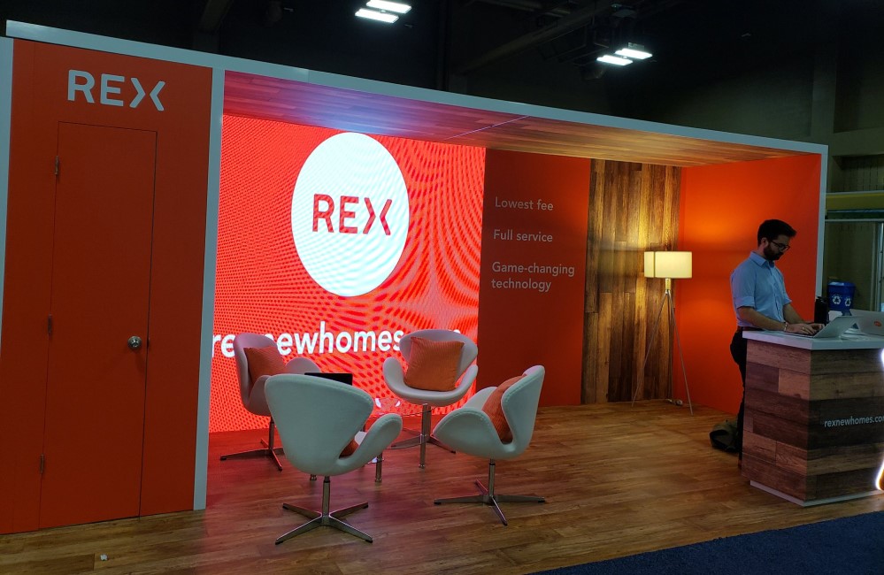 REX staff at a trade show for real estate industry