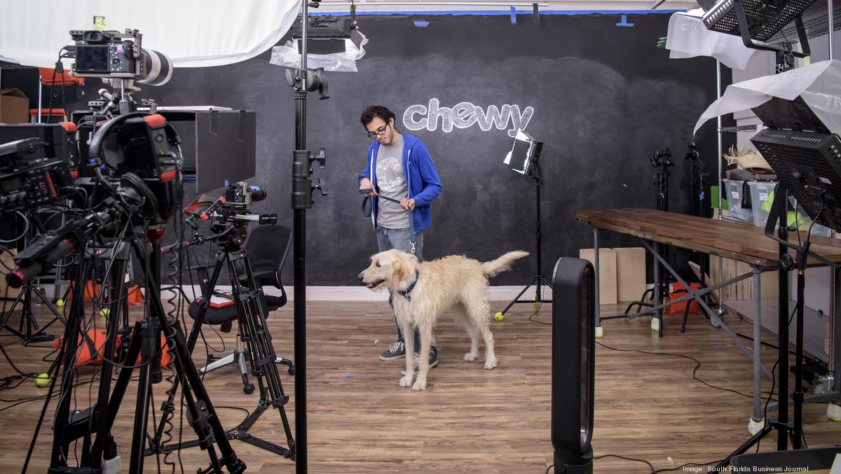 Chewy staff with pet in a photoshoot