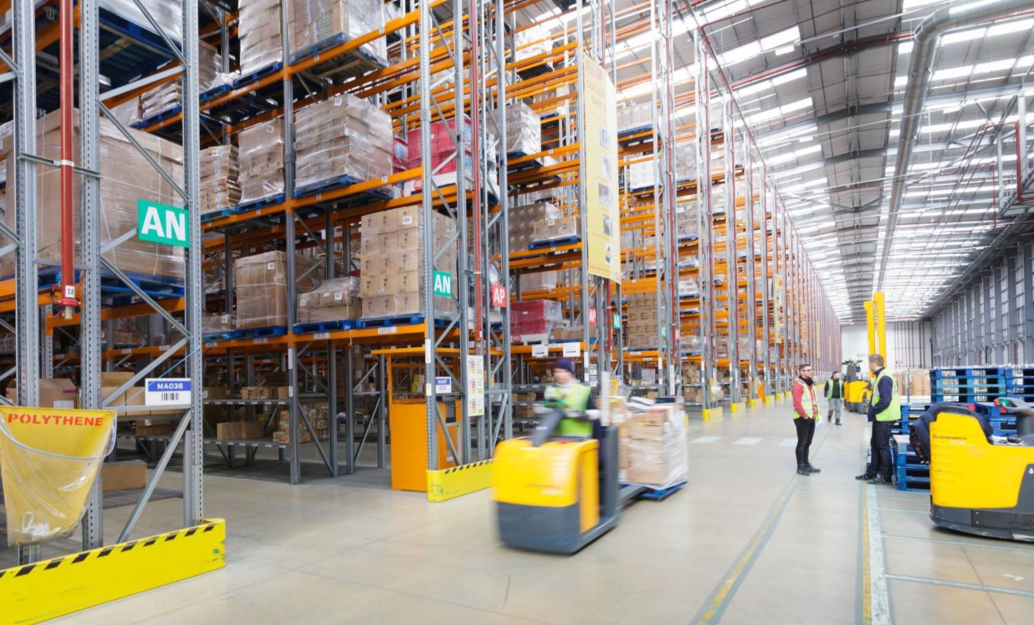 Frontline workers in warehouse use app to manage inventory