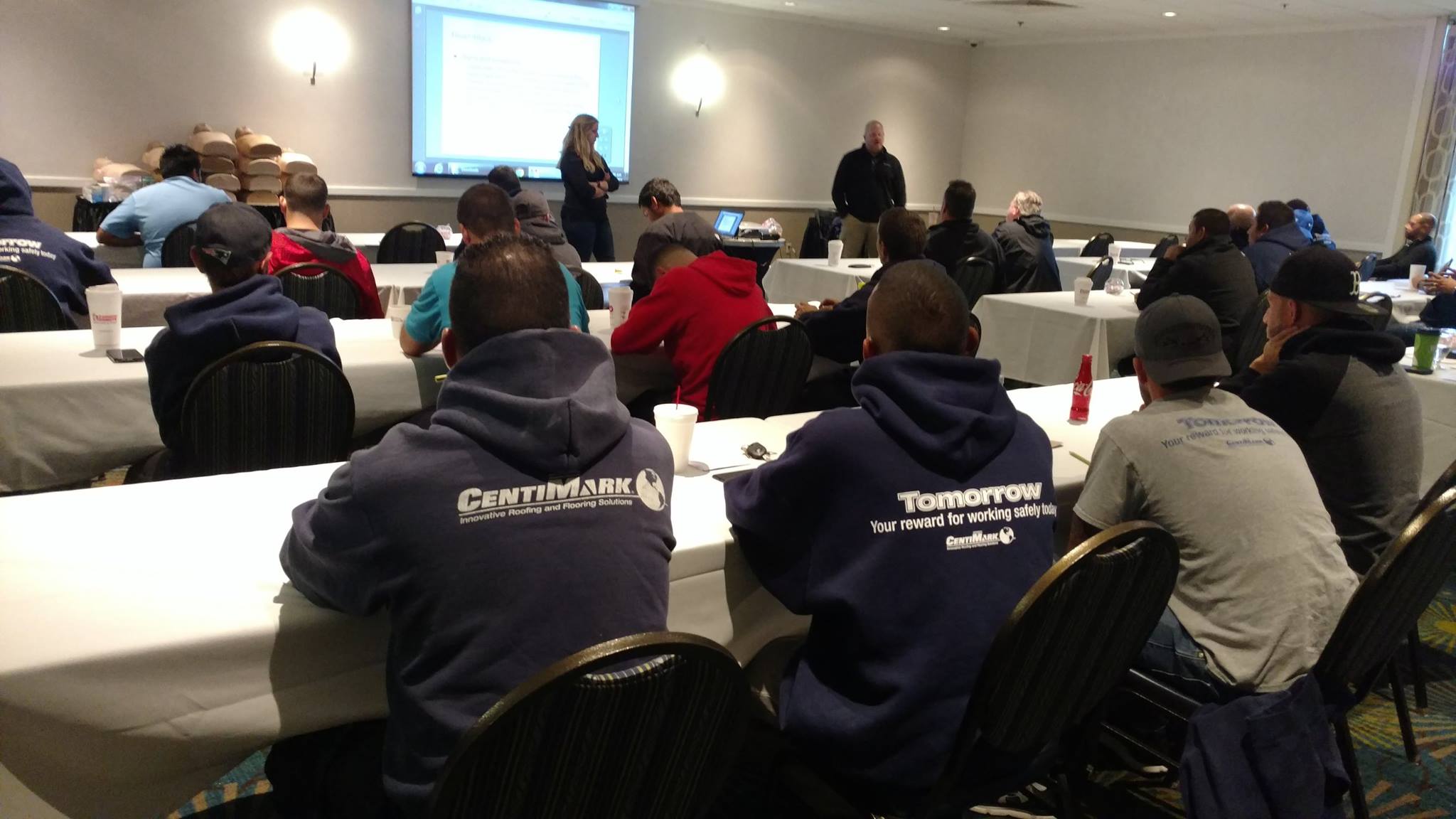 CentiMark staff speak to frontline workers in a training session